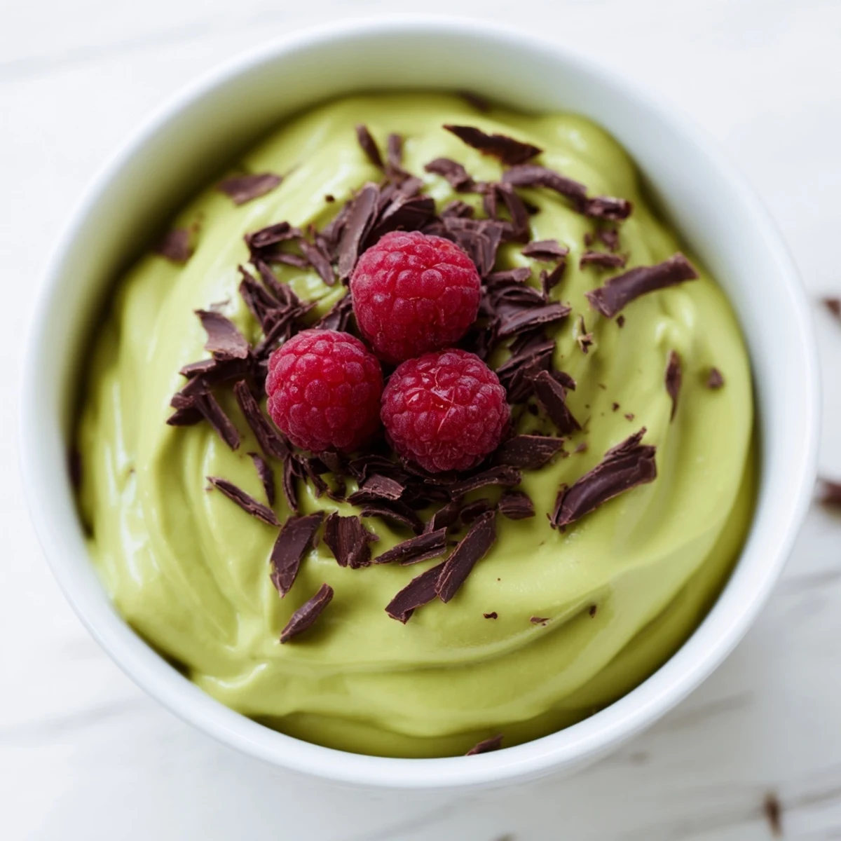Delicious avocado chocolate pudding, smooth and rich, perfect for a dairy-free treat with fresh toppings.