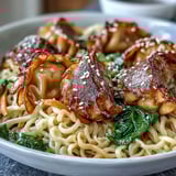 This quick one-pan Potsticker Noodle Bowls dinner features savory dumplings and tender noodles in a glossy garlic soy sauce.
