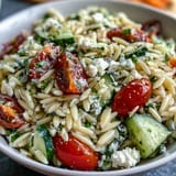 Fresh orzo salad with creamy feta, bright lemon, and cool cucumber.