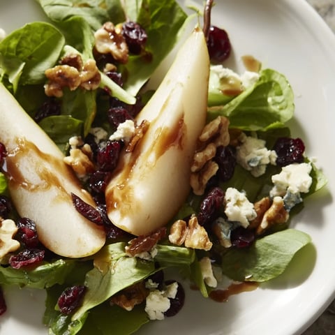 Freshly sliced pears and crumbled Gorgonzola cheese atop a bed of crisp mixed greens, drizzled with honey-balsamic vinaigrette.