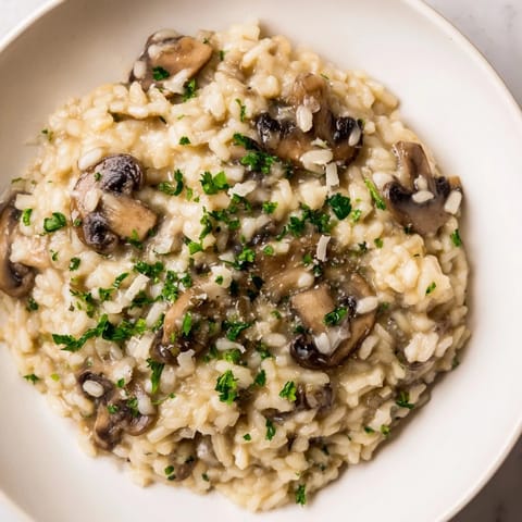 A steaming bowl of Stove-Top Creamy Risotto, a rich, comforting Italian rice dish.