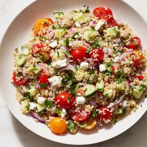 Make-Ahead Quinoa Salad with Lemon Vinaigrette, showcasing fresh vegetables and bright flavors, ready to serve.