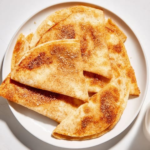Freshly baked cinnamon sugar tortilla chips, served warm and ready to dip in chocolate sauce or whipped cream.