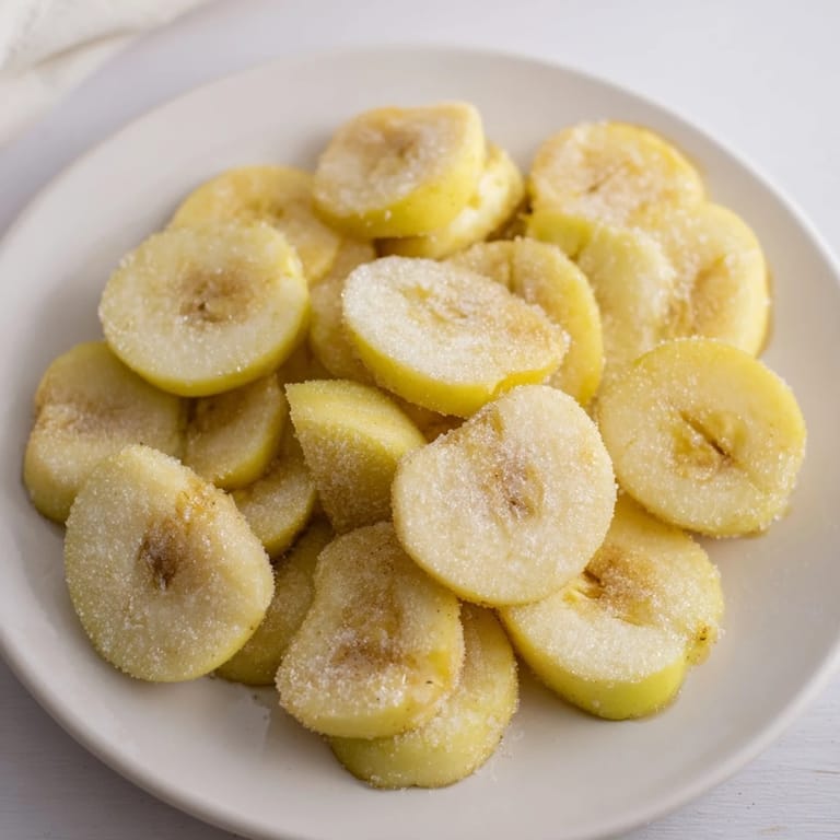 Warm aroma of baked apple slices with cinnamon, perfect for a cozy dessert, visually enticing.
