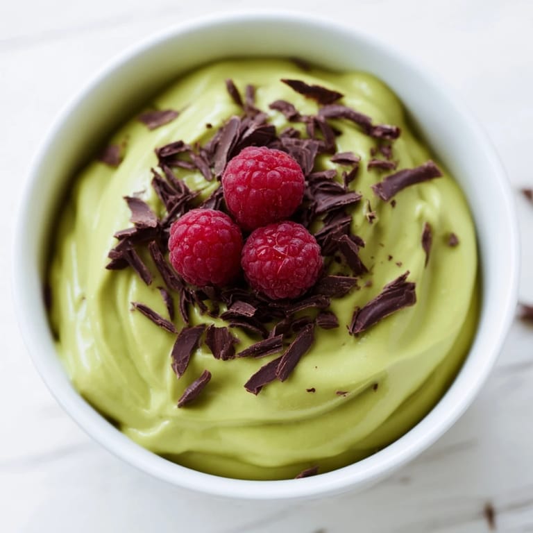 Delicious avocado chocolate pudding, smooth and rich, perfect for a dairy-free treat with fresh toppings.